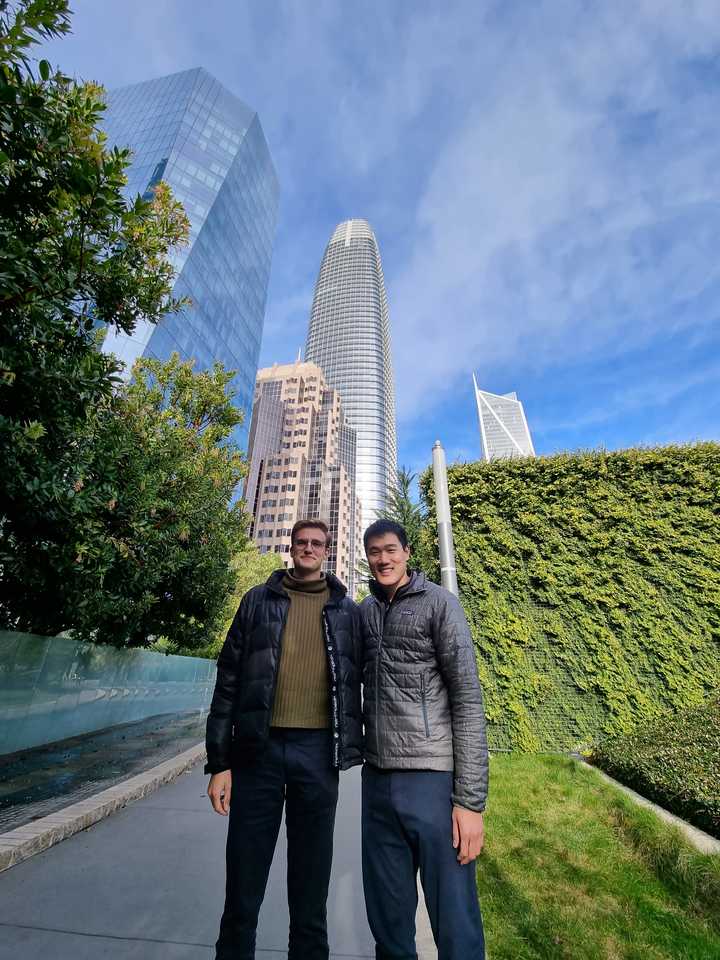 Joël Hainzl, left, with Dex founder and CEO Kevin Sun in front of the Salesforce Tower, San Francisco