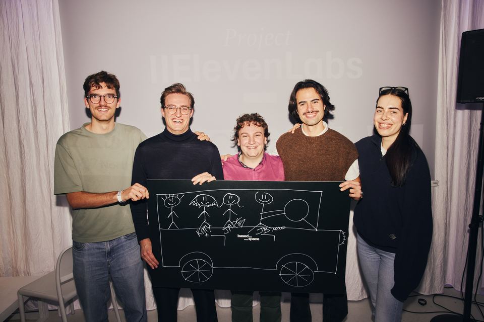Joël Hainzl, second from left, with his four teammates holding the car shaped prize board at the ElevenLabs hackathon in Warsaw, December 2025