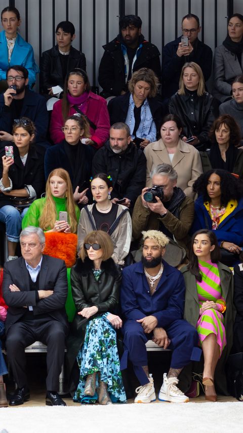 Front row at a fashion show in London with Anna Wintour in dark glasses